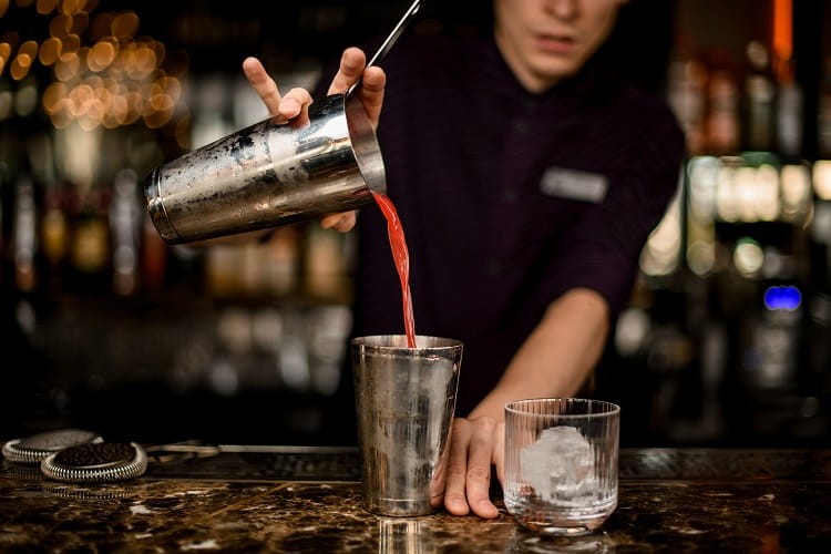 bigstock-Male-Bartender-Pouring-A-Red-C-336853834 750.jpg